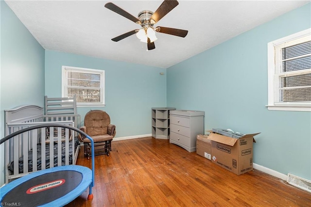 753 Wolf Island Rd, Reidsville, NC 27320 - bedroom featuring hardwood / wood-style flooring and ceiling fan