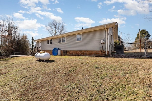 753 Wolf Island Rd, Reidsville, NC 27320 - rear view of house with central AC unit and a lawn