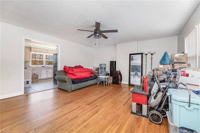 753 Wolf Island Rd, Reidsville, NC 27320 - bedroom with ceiling fan, ensuite bath, light hardwood / wood-style flooring, and a textured ceiling