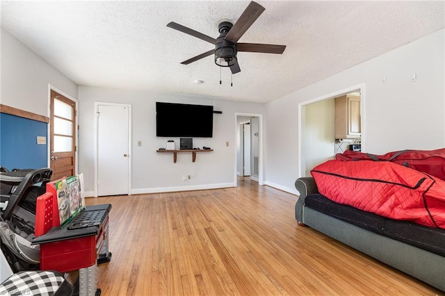 753 Wolf Island Rd, Reidsville, NC 27320 - bedroom with ceiling fan, light hardwood / wood-style flooring, and a textured ceiling