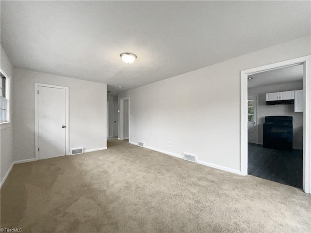 unfurnished bedroom featuring carpet flooring and a closet