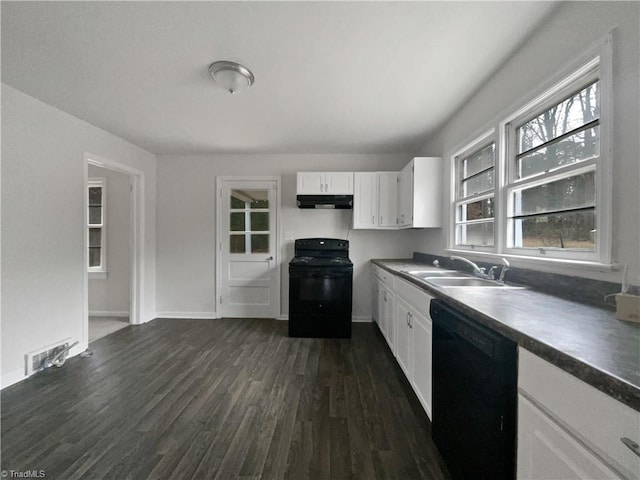 kitchen with black appliances, dark hardwood / wood-style flooring, white cabinets, and sink