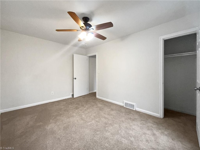 unfurnished bedroom featuring carpet flooring, ceiling fan, and a closet