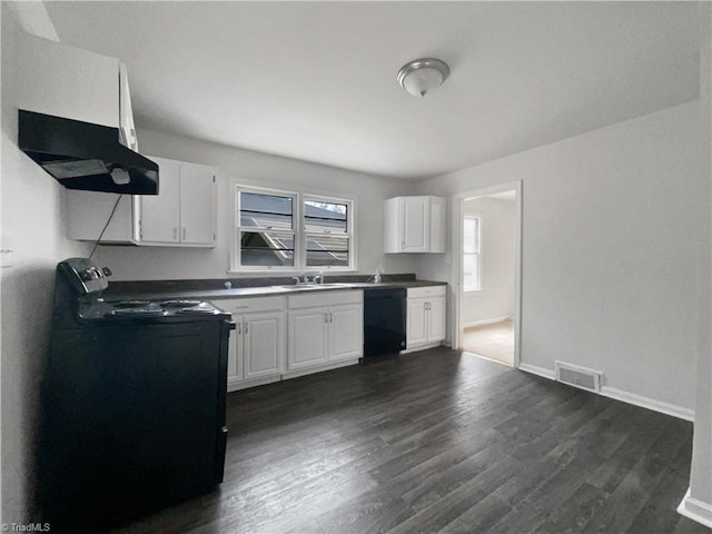 kitchen with black appliances, white cabinets, dark wood-type flooring, and extractor fan