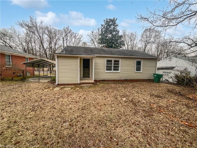 back of property featuring a carport