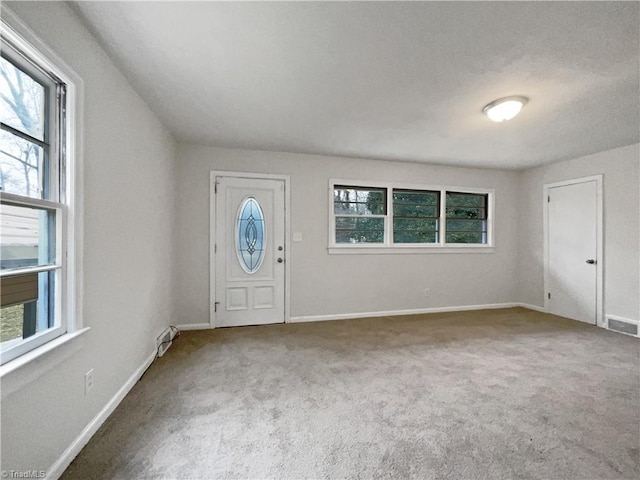 view of carpeted entrance foyer