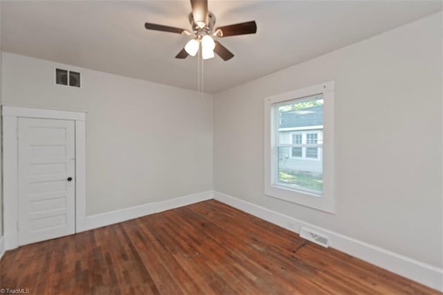 712 Englewood St, Greensboro, NC 27403 - unfurnished room with wood finished floors, baseboards, and a ceiling fan