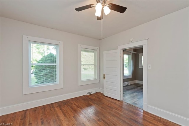 712 Englewood St, Greensboro, NC 27403 - unfurnished room with baseboards, wood finished floors, and ceiling fan