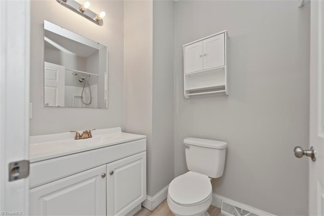 712 Englewood St, Greensboro, NC 27403 - full bathroom featuring baseboards, toilet, vanity, and a shower