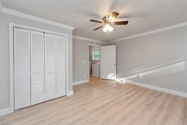 712 Englewood St, Greensboro, NC 27403 - unfurnished bedroom featuring a closet, wood finished floors, washer / clothes dryer, baseboards, and crown molding