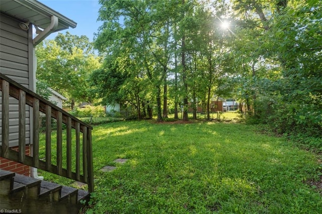 712 Englewood St, Greensboro, NC 27403 - view of grassy yard with stairway