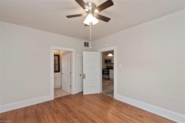 712 Englewood St, Greensboro, NC 27403 - unfurnished room featuring baseboards, ceiling fan, and light wood-type flooring