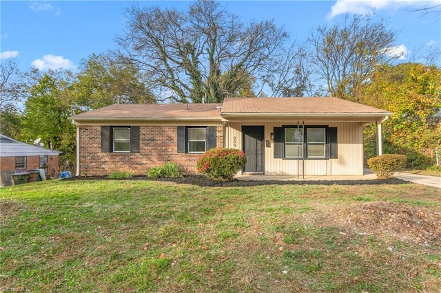 single story home with a front lawn and a porch