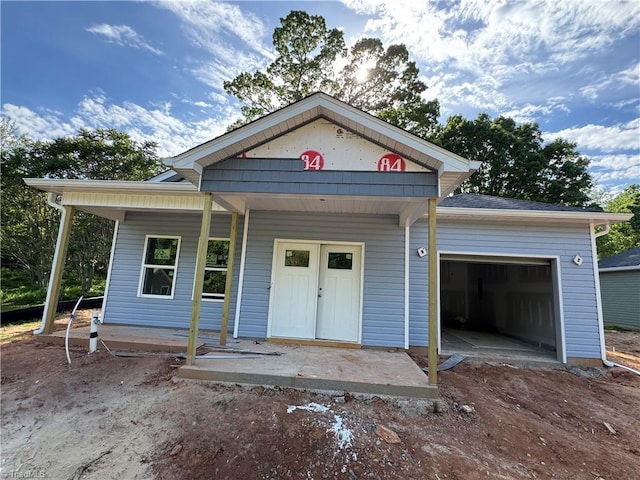 3145 Chapel St, Walkertown, NC 27051 - view of front facade featuring an attached garage and a porch