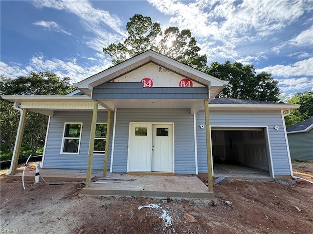 3145 Chapel St, Walkertown, NC 27051 - view of front of house featuring a garage and a porch