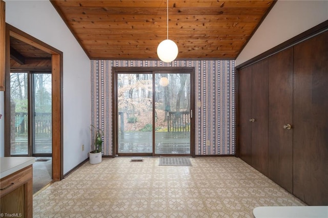 interior space featuring lofted ceiling, light floors, wooden ceiling, and visible vents