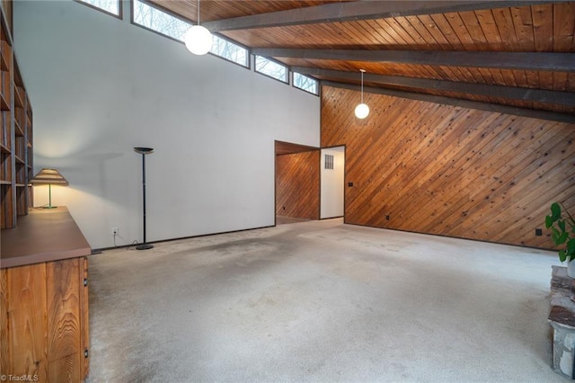 interior space featuring wooden ceiling, wood walls, and carpet flooring