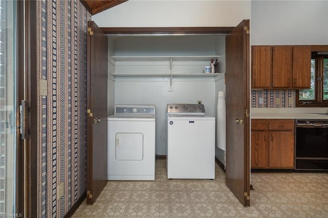 laundry room featuring laundry area, washer and clothes dryer, and light floors