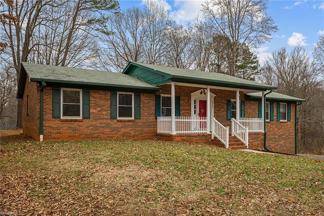 ranch-style house with a front lawn and a porch