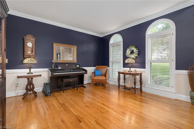 6516 Dornoch Dr, Greensboro, NC 27410 - sitting room featuring wood finished floors and ornamental molding