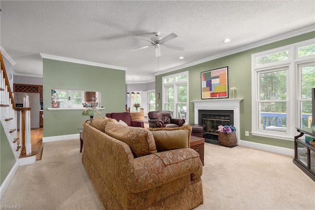 6516 Dornoch Dr, Greensboro, NC 27410 - living area featuring light carpet, crown molding, baseboards, stairway, and ceiling fan