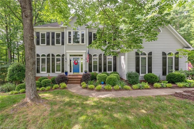6516 Dornoch Dr, Greensboro, NC 27410 - view of front facade with a front yard