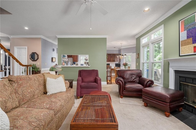 6516 Dornoch Dr, Greensboro, NC 27410 - carpeted living room featuring ornamental molding, a fireplace with flush hearth, a ceiling fan, recessed lighting, and stairway
