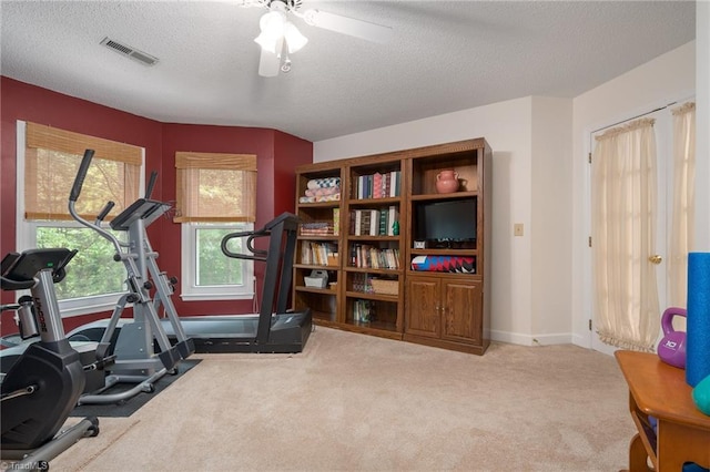 6516 Dornoch Dr, Greensboro, NC 27410 - exercise room with a textured ceiling, carpet floors, ceiling fan, and baseboards