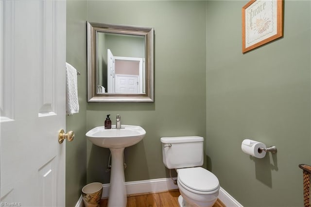 6516 Dornoch Dr, Greensboro, NC 27410 - half bathroom featuring toilet and baseboards