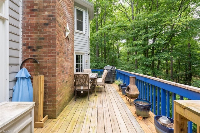 6516 Dornoch Dr, Greensboro, NC 27410 - wooden terrace with outdoor dining space and grilling area
