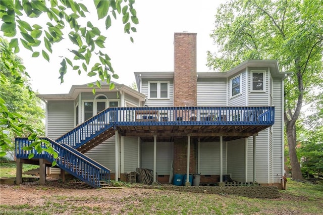 6516 Dornoch Dr, Greensboro, NC 27410 - back of house featuring a wooden deck, stairs, a chimney, and crawl space