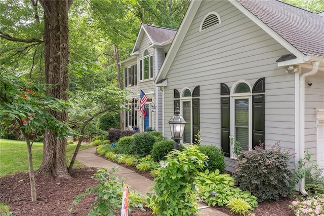 6516 Dornoch Dr, Greensboro, NC 27410 - view of home's exterior featuring a shingled roof and an attached garage
