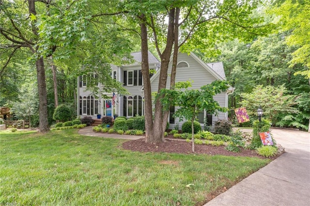 6516 Dornoch Dr, Greensboro, NC 27410 - colonial home with a front yard and concrete driveway