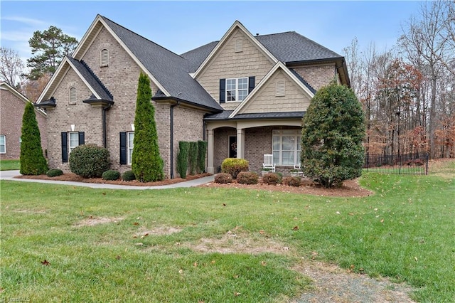 craftsman-style house with a front yard