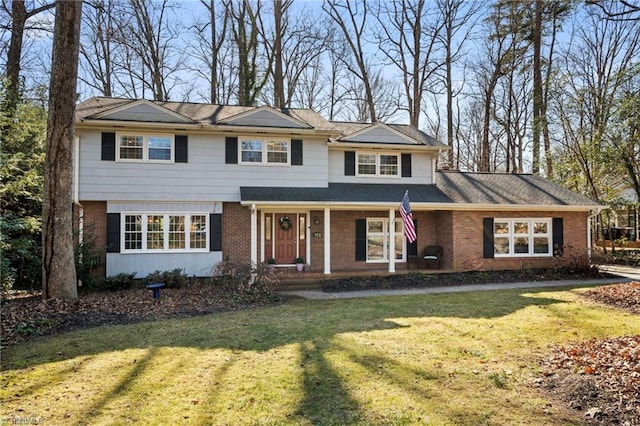 front of property featuring a front yard and covered porch