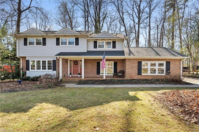 front facade featuring a front yard and a porch