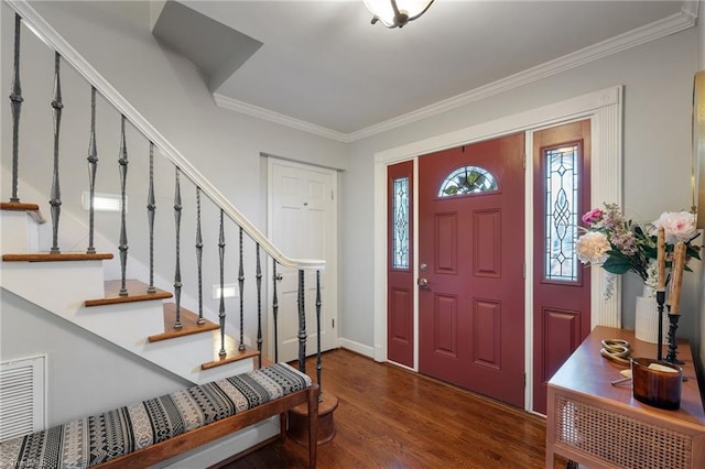 foyer featuring dark hardwood / wood-style flooring and crown molding