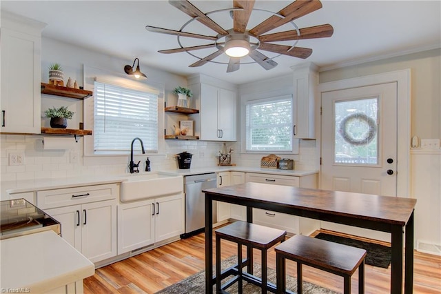3412 Smithtown Rd, East Bend, NC 27018 - kitchen with stainless steel dishwasher, open shelves, a sink, and light wood-type flooring