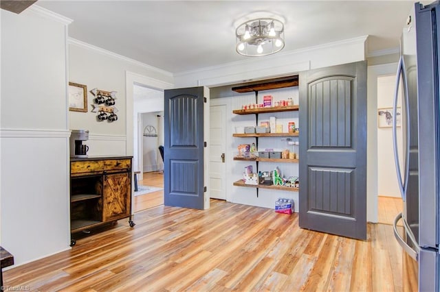3412 Smithtown Rd, East Bend, NC 27018 - interior space with light wood finished floors, crown molding, and a chandelier