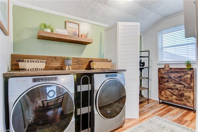 3412 Smithtown Rd, East Bend, NC 27018 - laundry area featuring washing machine and dryer, wood finished floors, and ornamental molding