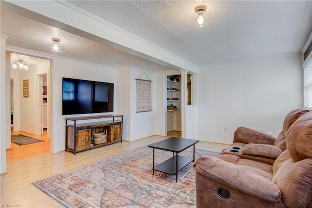3412 Smithtown Rd, East Bend, NC 27018 - living area with wood finished floors, ornamental molding, built in features, and decorative columns