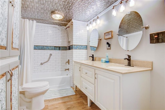 3412 Smithtown Rd, East Bend, NC 27018 - bathroom featuring an ornate ceiling, shower / tub combo, wood finished floors, toilet, and double vanity