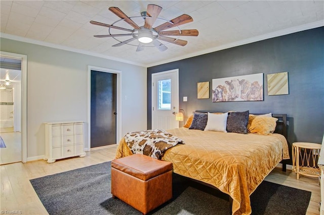 3412 Smithtown Rd, East Bend, NC 27018 - bedroom featuring wood finished floors, ornamental molding, ceiling fan, and baseboards