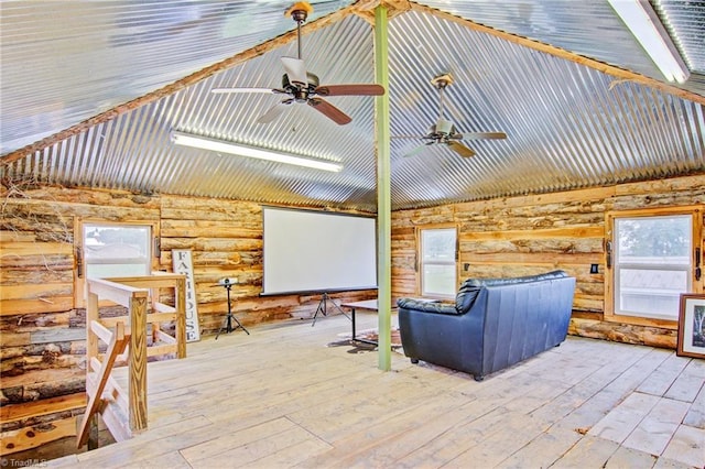 3412 Smithtown Rd, East Bend, NC 27018 - living area with log walls, healthy amount of natural light, hardwood / wood-style flooring, high vaulted ceiling, and a ceiling fan