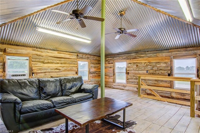 3412 Smithtown Rd, East Bend, NC 27018 - living area featuring wood-type flooring, wooden walls, cooling unit, and plenty of natural light