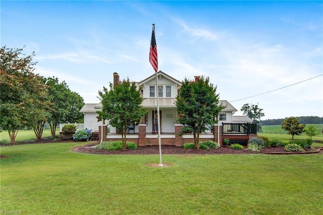 3412 Smithtown Rd, East Bend, NC 27018 - view of front of property with a front lawn, covered porch, a chimney, and metal roof
