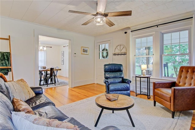 3412 Smithtown Rd, East Bend, NC 27018 - living area with light wood-style flooring, a chandelier, ceiling fan, and crown molding