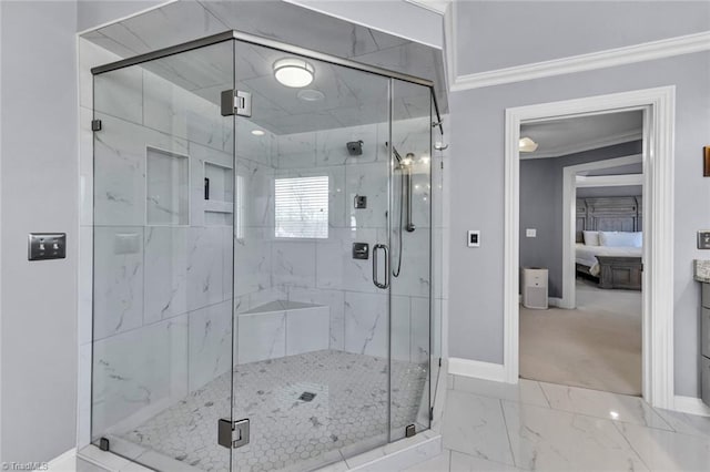 full bath featuring connected bathroom, baseboards, marble finish floor, ornamental molding, and a marble finish shower