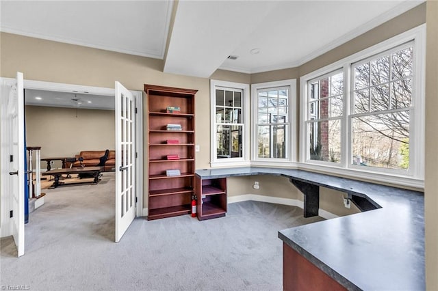 carpeted home office with baseboards, visible vents, ornamental molding, and french doors