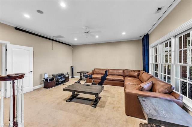 living room featuring ornamental molding, recessed lighting, light colored carpet, and a ceiling fan